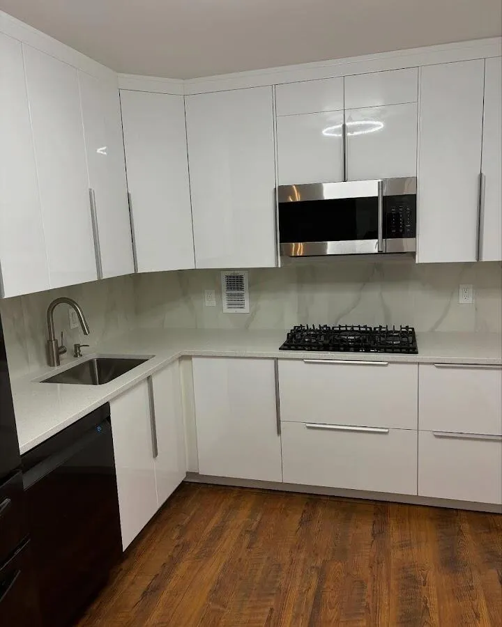 Restored kitchen with white cabinets after water damage in Wilna